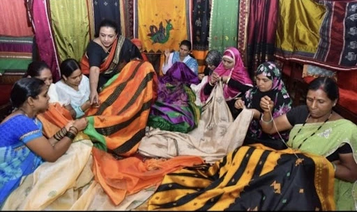 Women artisans practicing traditional Kasuti embroidery in a workshop